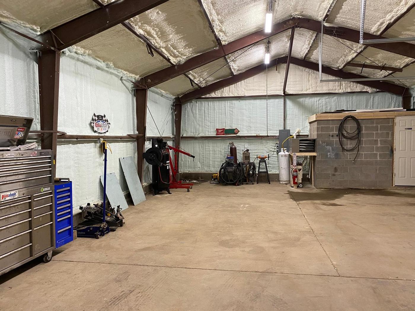 Second shop bay with welders, an engine crane and a compressor